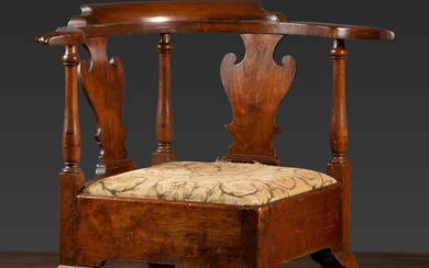 A Queen Anne Carved Walnut Knuckle-Arm and Trifid Foot Corner Chair