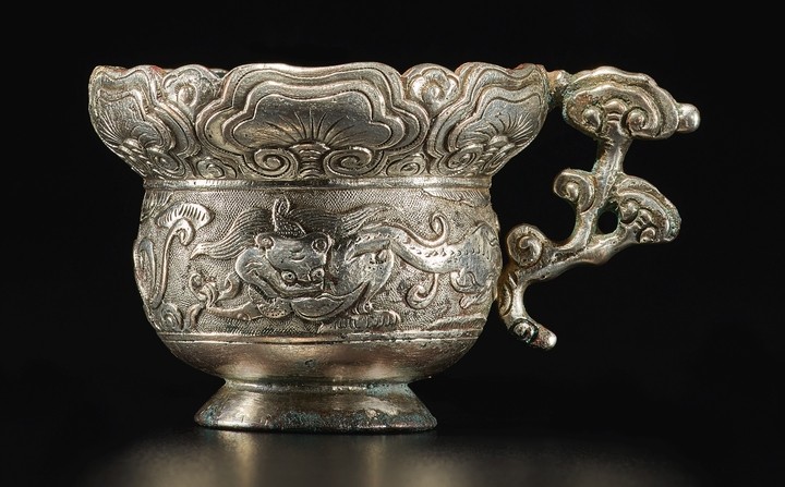A RARE SILVER 'CHILONG AND LINGZHI' HANDLED CUP SONG DYNASTY