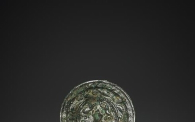 A RARE SILVERED BRONZE 'LIONS AND GRAPEVINES' MIRROR