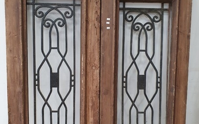 A SET OF RUSTIC TIMBER SHUTTERS