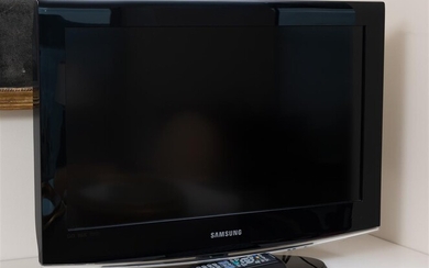 A Samsung small tv monitor, model LA26B450C4D, model code LA26B450C4DXXY,...