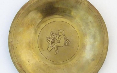 A Scandinavian cast metal dish with central Pan figure