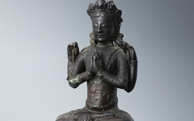 A Sino-Tibetan bronze seated Buddha