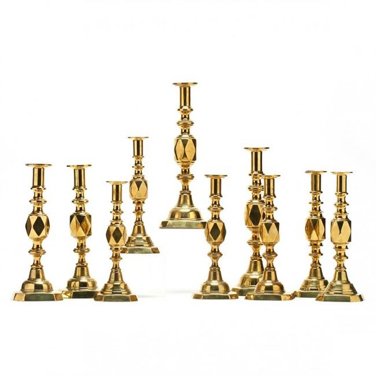 A Suite of Antique Brass Diamond Candlesticks