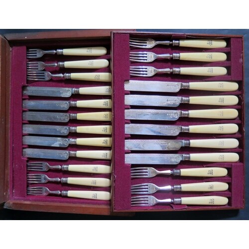A Victorian Mahogany Canteen of Silver and Ivory Handled Fru...
