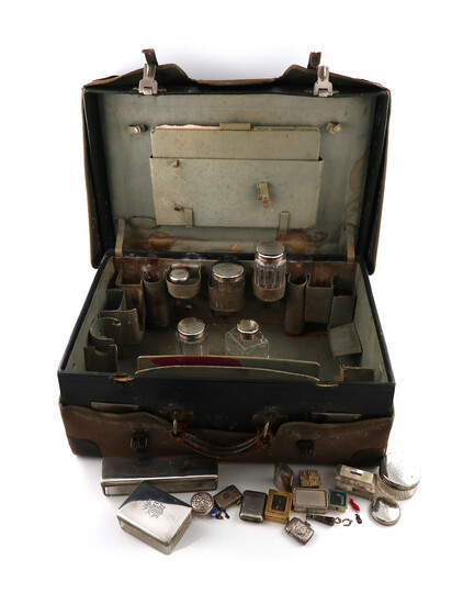 A Victorian silver mounted travelling dressing table set
