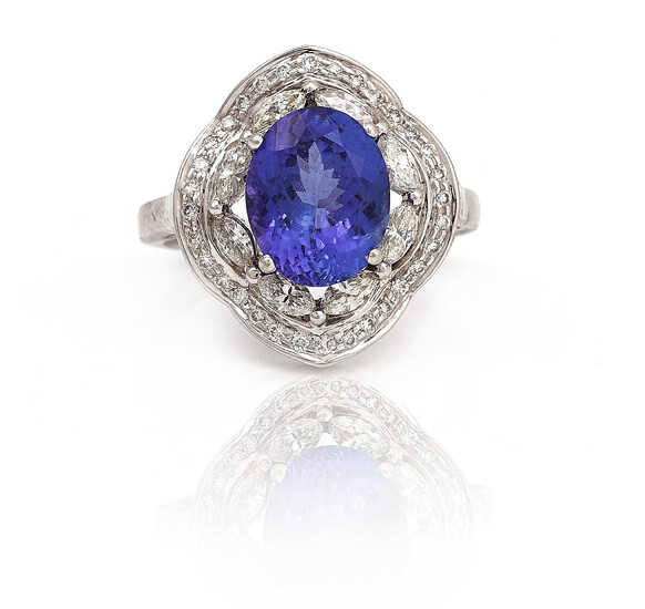 A WHITE GOLD, TANZANITE AND DIAMOND CLUSTER RING