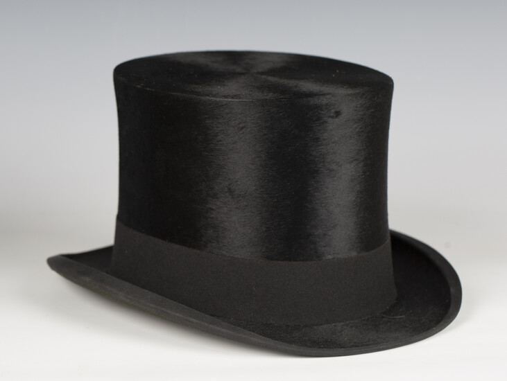 A black silk top hat by G.A. Dunn & Co of London, head circumference 56cm.
