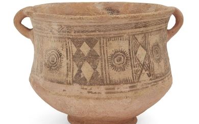 A buffware pottery vessel with hatched decoration, Persia, 3rd millenium BC, on a raised foot,with small handle either side, 26cm. diam. x 20cm. high