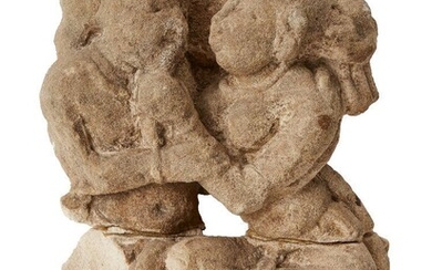 A carved sandstone fragment of a couple, possibly Satavahana, India, the woman playfully tugging her lover's beard, repaired, 24cm. high Provenance: Formerly in the Private Collection of Werner Forman (1921-2010)
