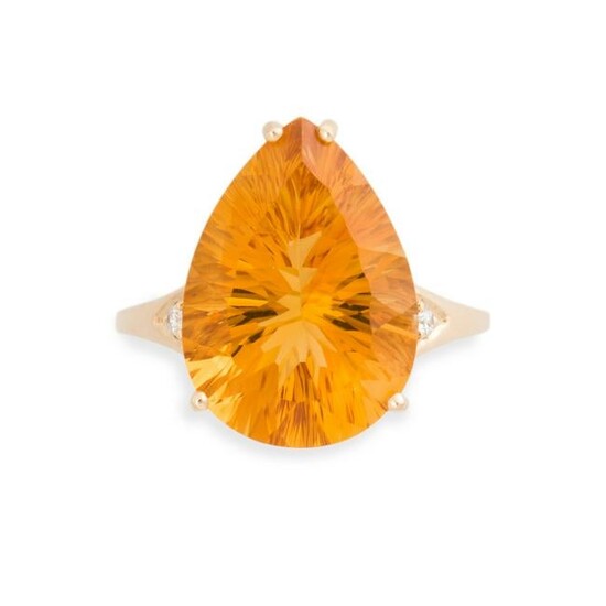 A citrine, diamond and fourteen karat gold ring