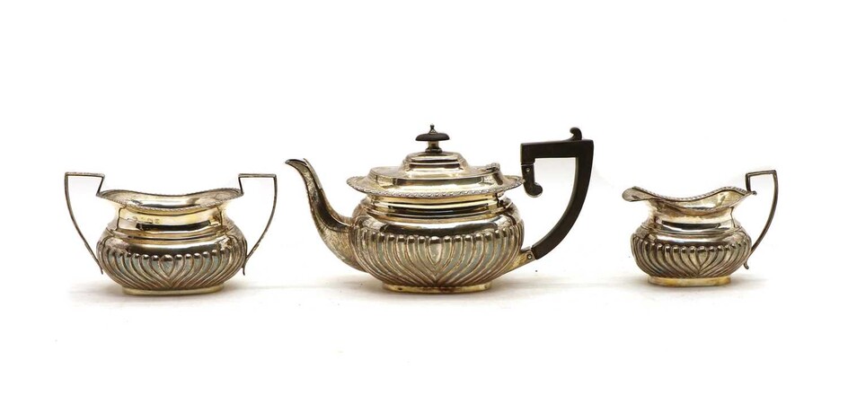 A composed three piece silver tea service