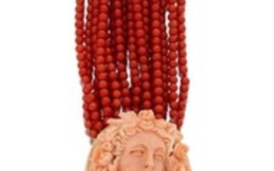 A coral sautoir necklace with coral cameo clasp, composed of seventeen rows of coral corallium rubrum uniform beads to an oval coral cameo clasp depicting the head of Flora, clasp stamped 750, approx. length 74cm