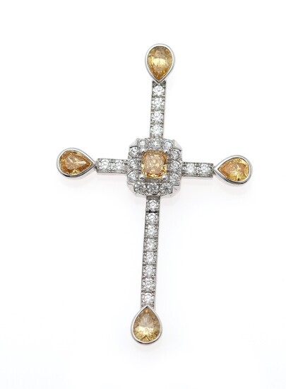 NOT SOLD. A diamond pendant set with numerous Fancy Orangy Yellow and white diamonds weighing...