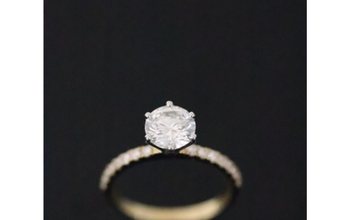 A diamond solitaire ring set with diamond shoulders I half w...