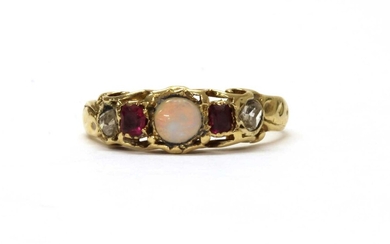 A gold opal, ruby and diamond ring