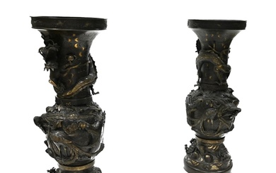 A large pair of Japanese Meiji period bronze vases, each spl...