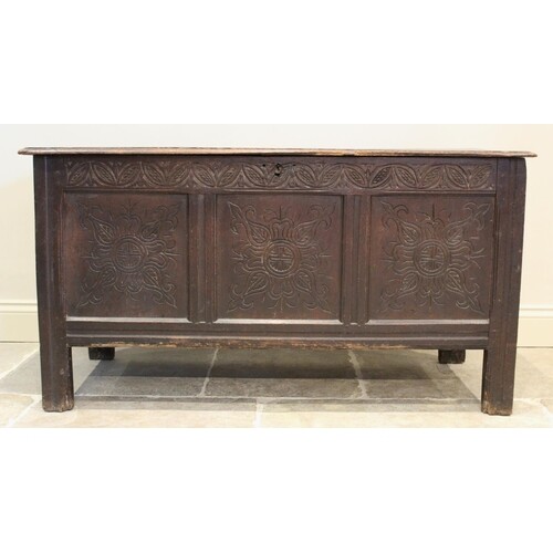 A late 17th/early 18th century oak coffer, the twin plank mo...