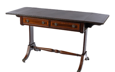 A mahogany vintage English sofa table C: 1950. The figured...