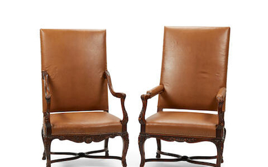 A matched pair of Régence style walnut fauteuils a la Reine