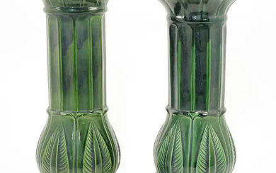 A near pair of West German green majolica jardiniere stands, 20th century,...