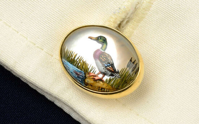 A pair of 18ct gold reverse-carved and painted rock crystal cufflinks, depicting a mallard duck and pheasant, by Deakin & Francis.