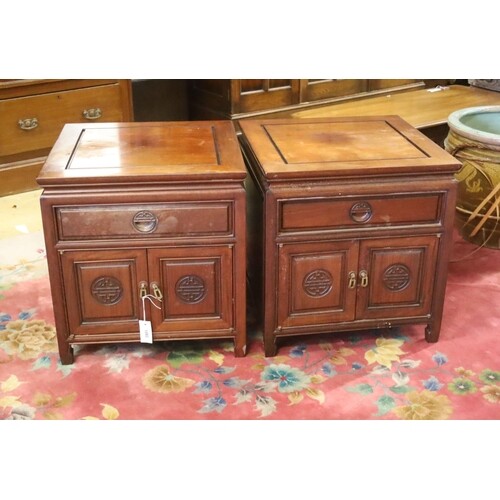 A pair of Chinese carved hardwood low cabinets, width 56cm, ...