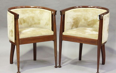 A pair of Edwardian Arts and Crafts style mahogany tub back chairs, the seat rails with chequer band