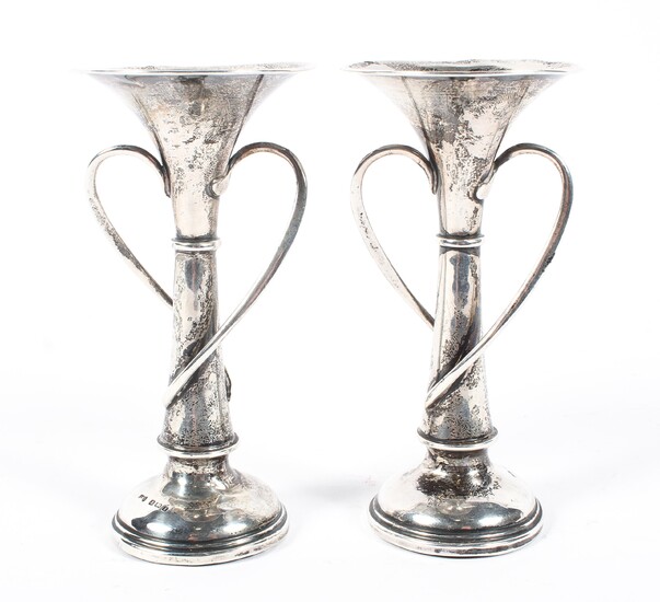 A pair of Edwardian silver spill vases, adorned with two flowing vines in the Art Nouveau style