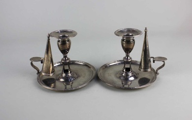 A pair of George III silver chambersticks