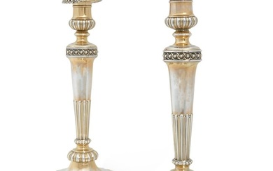 A pair of George III weighted silver candlesticks