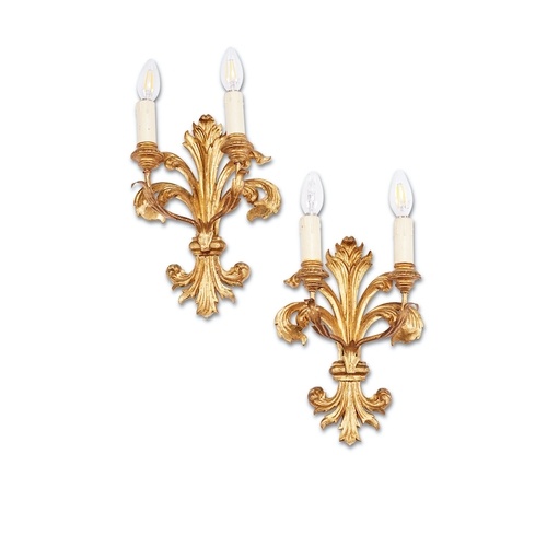 A pair of Italian carved giltwood fleur-de-lys twin-light wa...