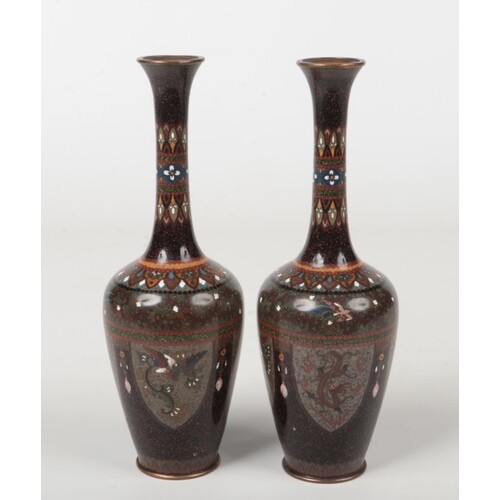 A pair of Japanese Meiji period cloisonne bottle vases. Blac...