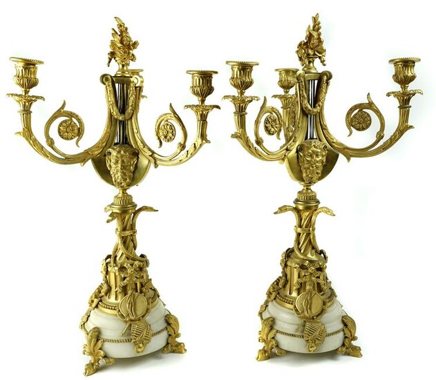 A pair of Rococo style gilt bronze candelabras