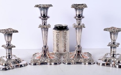 A pair of Silver plated candlesticks together with a smaller pair largest 20 cm (4).