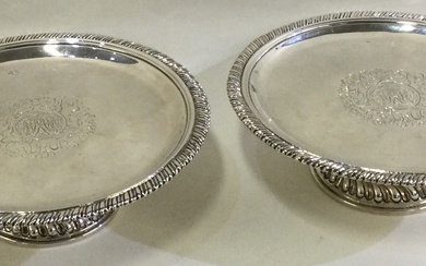 A pair of circular early 18th Century silver tazzas.