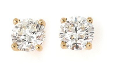 A pair of diamond solitaire ear studs each set with a brilliant-cut diamond weighing a total of 1.01 ct., mounted in 18k gold. Colour: Wesselton (H). Clarity: VVS. (2)