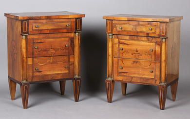 A pair of early 20th century Continental walnut and foliate inlaid bedside chests of three drawers