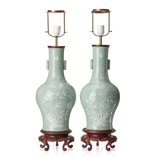 A pair of large celadon glazed slip decorated vases, Qing dynasty, 19th Century.