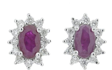 A pair of ruby and diamond cluster earrings.Total