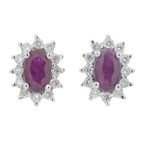 A pair of ruby and diamond cluster earrings.Total