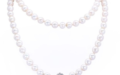 A single row uniform cultured pearl necklace with a diamond set clasp
