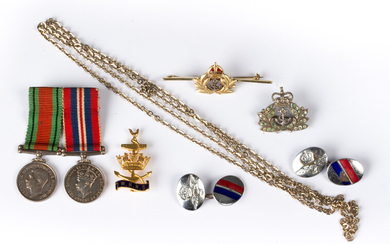 A small group of military related jewellery comprising