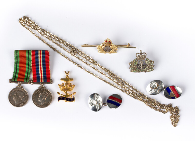 A small group of military related jewellery comprising