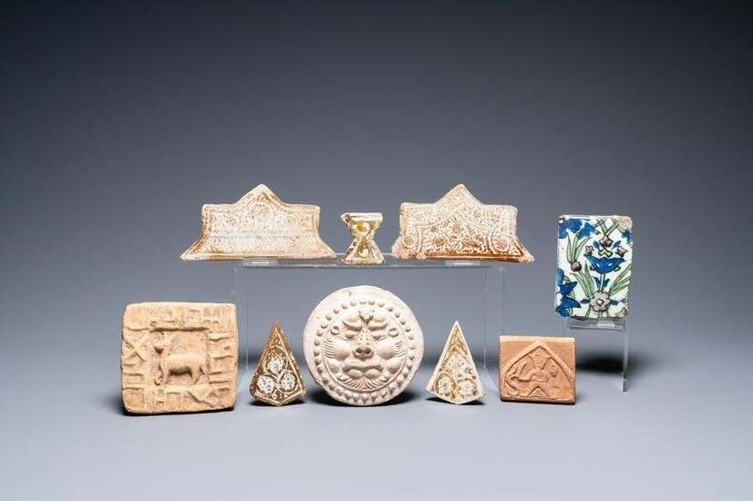 A study collection of nine tiles, some luster-glazed and molded, a.o. Damascus and Kashan, 14th C.