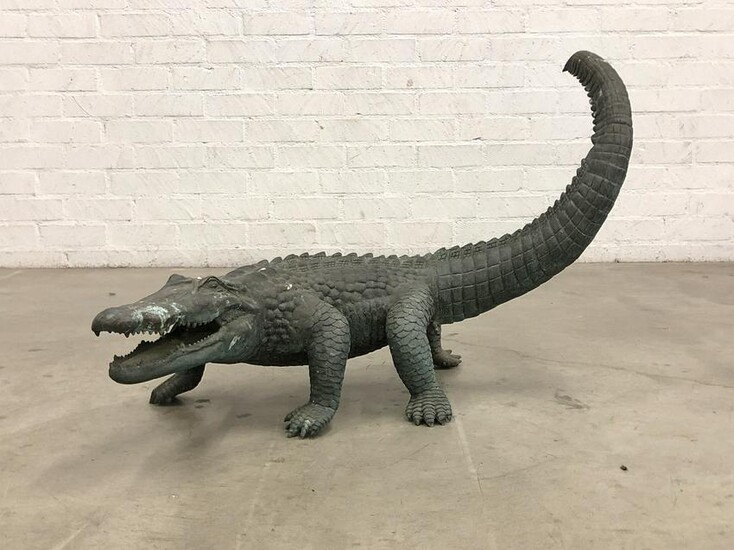 A verdigris patinated metal model of a crocodile