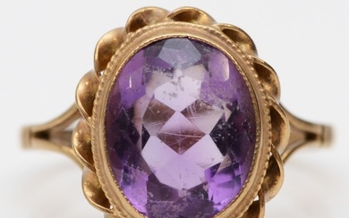 A vintage 9ct gold and amethyst dress ring, stone 12 x 10mm,...