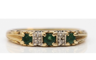 A vintage 9ct gold emerald and diamond five stone ring, L, 1...