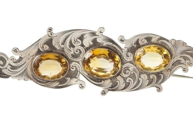 AN ANTIQUE SILVER AND CITRINE BROOCH