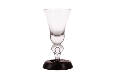 AN EARLY 18TH CENTURY NEWCASTLE HEAVY BALUSTER WINE GLASS